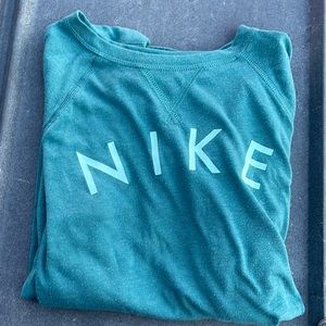 Size medium girls. Blue Nike top.